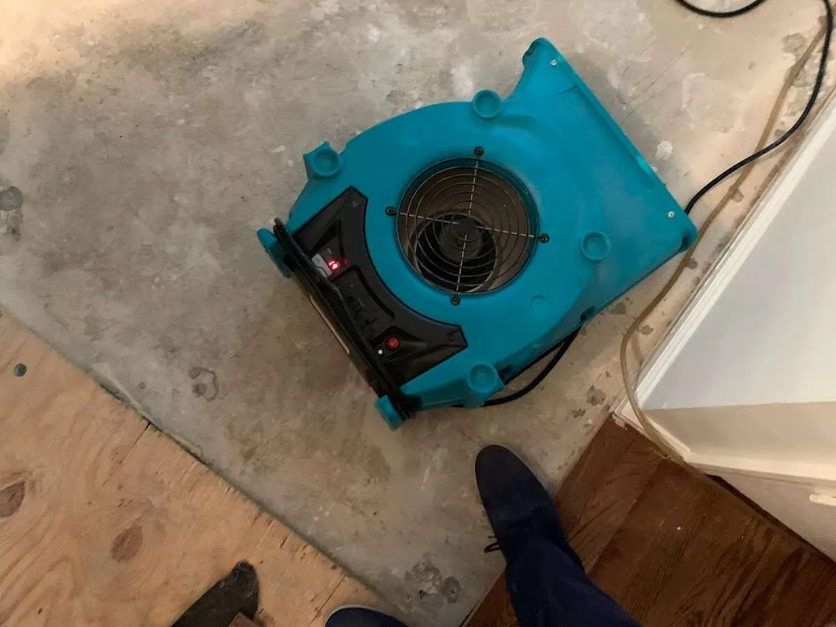 Air mover drying subfloor during Leak Detection & Repair in Walkersville